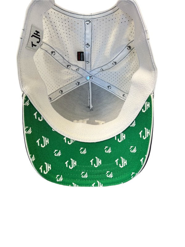 The inside of the #TeamJHall performance snapback, showing the mesh back and the white TJH logo clearly visible throughout the bottom of the green bill.