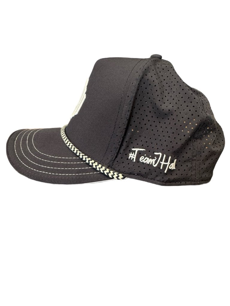 The navy #TeamJHall performance snapback facing to the side showing the mesh back and the #TeamJHall logo written on the side.