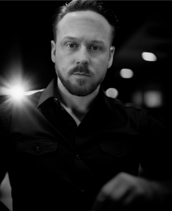 A black and white portrait of Jason Hall, the founder of #TeamJHall.