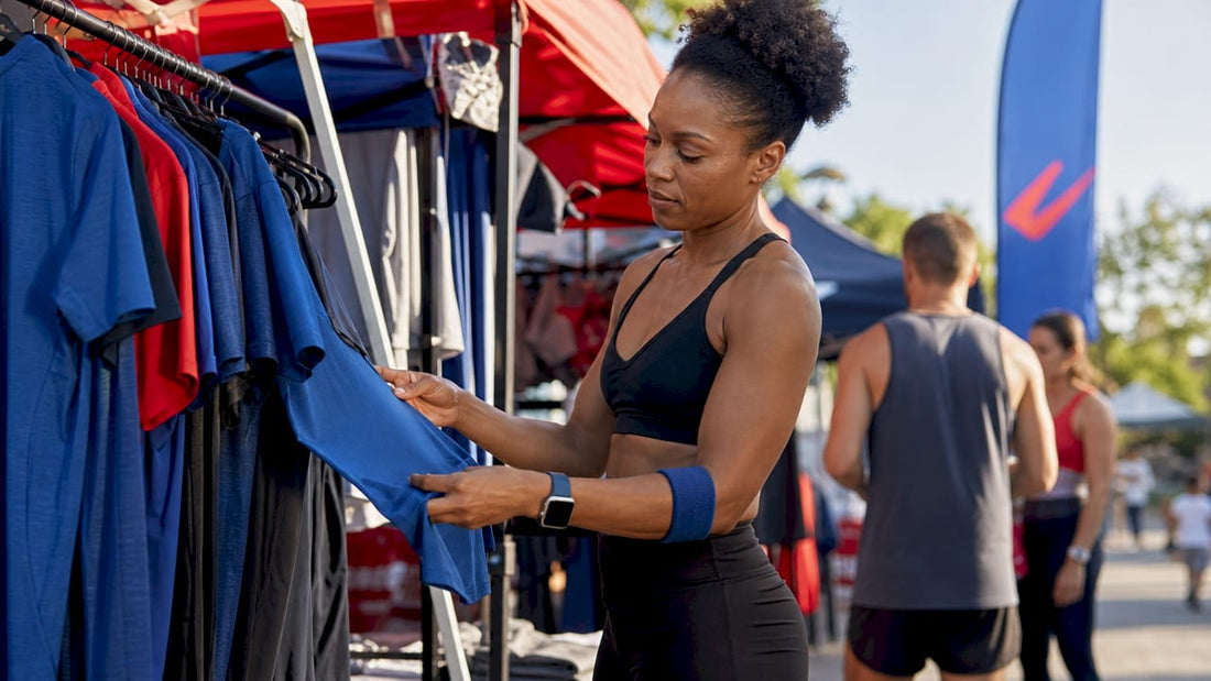Athletic woman examining sports apparel in store