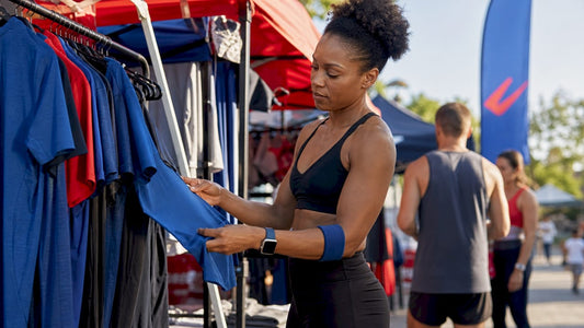 Athletic woman examining sports apparel in store