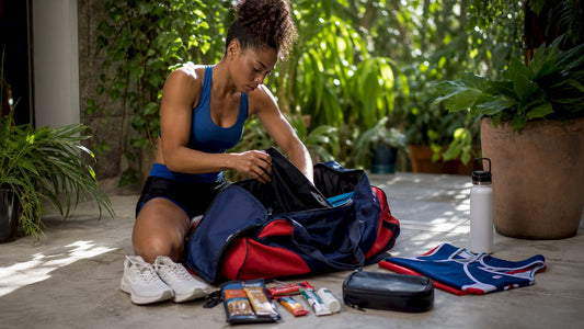 Female athlete packing competition bag indoors
