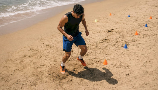 Soccer player performing fast footwork drills outdoors
