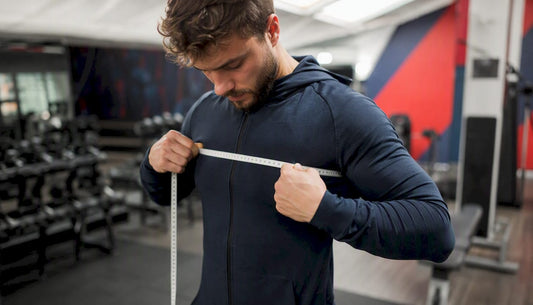 Athlete measuring chest with tape measure